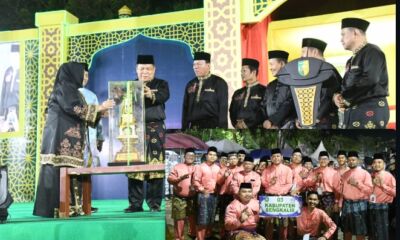 Bupati Kasmarni menyerahkan piala bergilir MTQ ke 44 Provinsi Riau pada pembukaan di Kuantan Singingi.